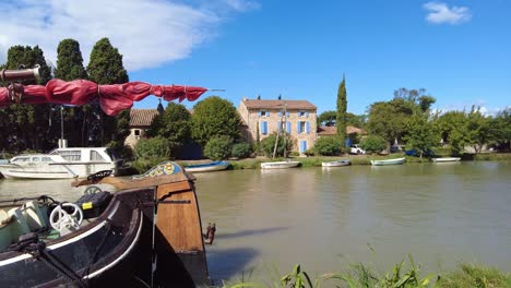 Barges-and-boats-docked-on-canal-side-canal-Du-Midi-France