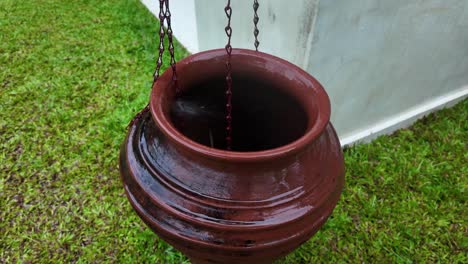 rain drops collection in vase urn clay pot outdoor rainy season static video