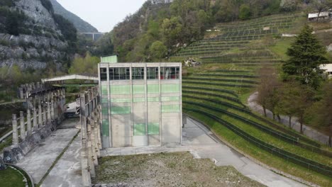 abandoned-cement-factory-monument-in-the-middle-of-nature-drone-4k