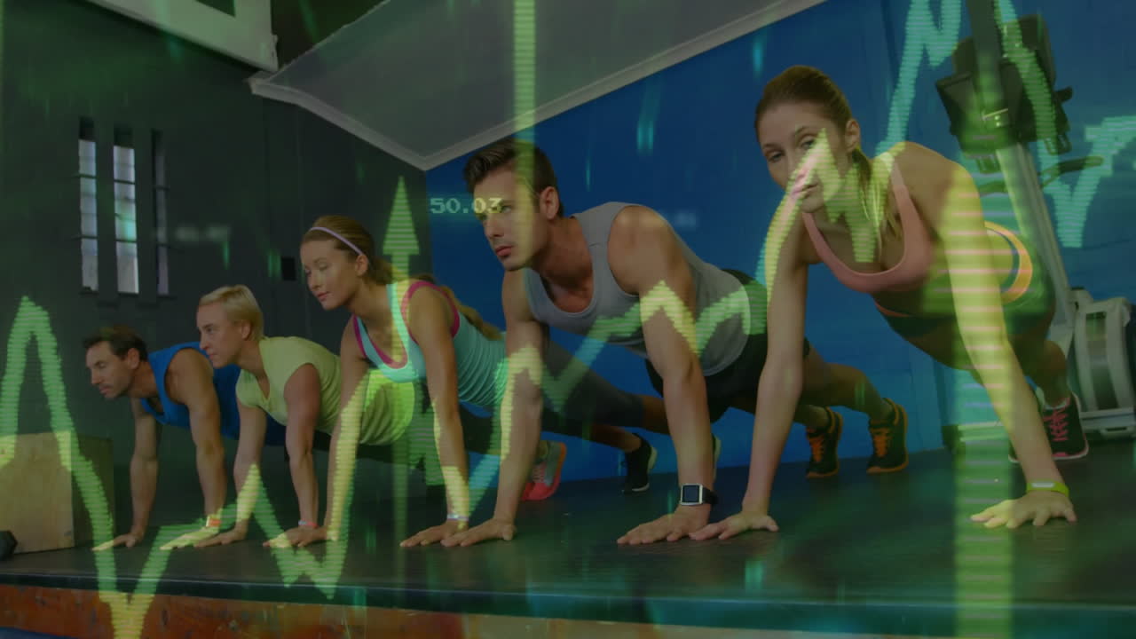 Five adults performing push-ups and planks in gym studio, with financial graphs overlaying