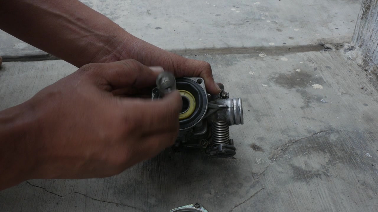 Removing Carburetor Cover to Access Internal Components