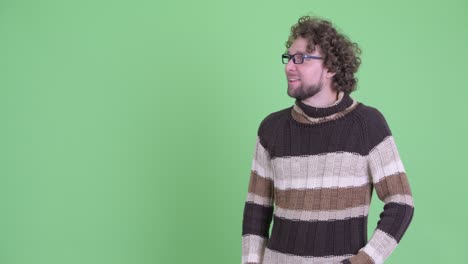 young handsome bearded man with curly hair