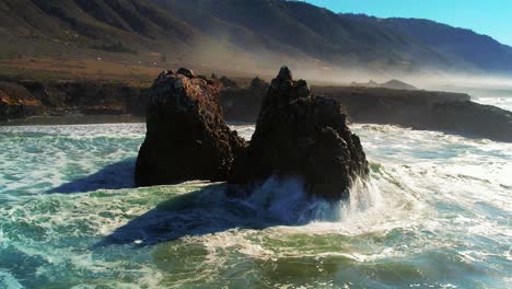 drone shot of waves crashing on scenic coastline at big sur state park off pacific coast highway in california 12