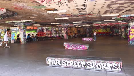 skateboarders performing tricks in urban skatepark