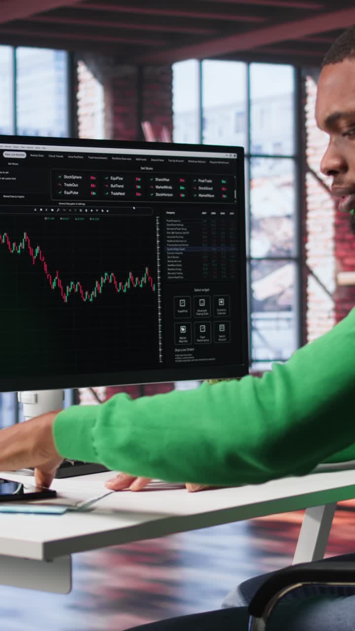 Vertical Video Day trader uses computer to purchase stocks that might perform well