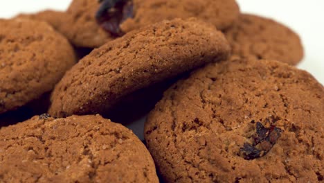 soft and chewy oatmeal raisin cookies. rotating on the turn table. isolated on white.