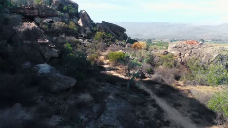 dirt track passing through rock formations 4k