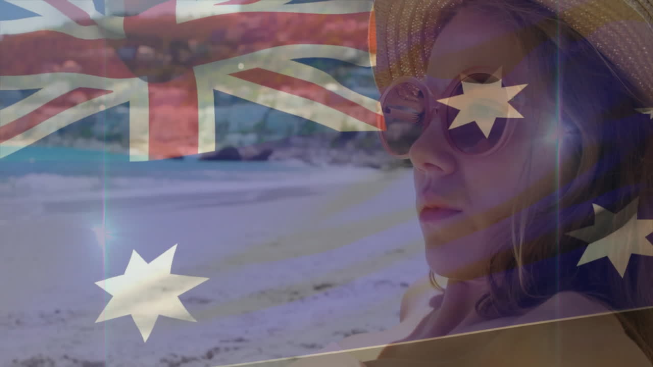 Relaxing on beach, woman with Australian flag overlay enjoying sunny day