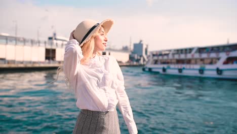 Slow-Motion:Beautiful-girl-poses-near-bosphorus-with-view-of-Galata-bridge-and-Istanbul