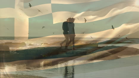 animation of waving greece flag against african american couple walking together at the beach