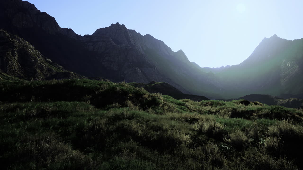 Mountain landscape bathed in sunlight during an early morning in the valley