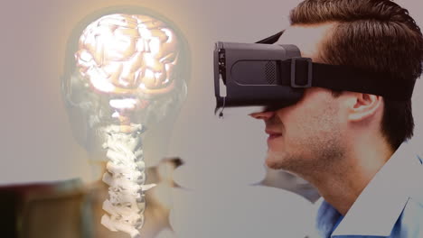 wearing virtual reality headset, man viewing brain and spinal cord animation