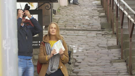 couple of tourist with camera and map