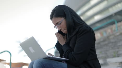 concentrated hindu businesswoman working outdoor