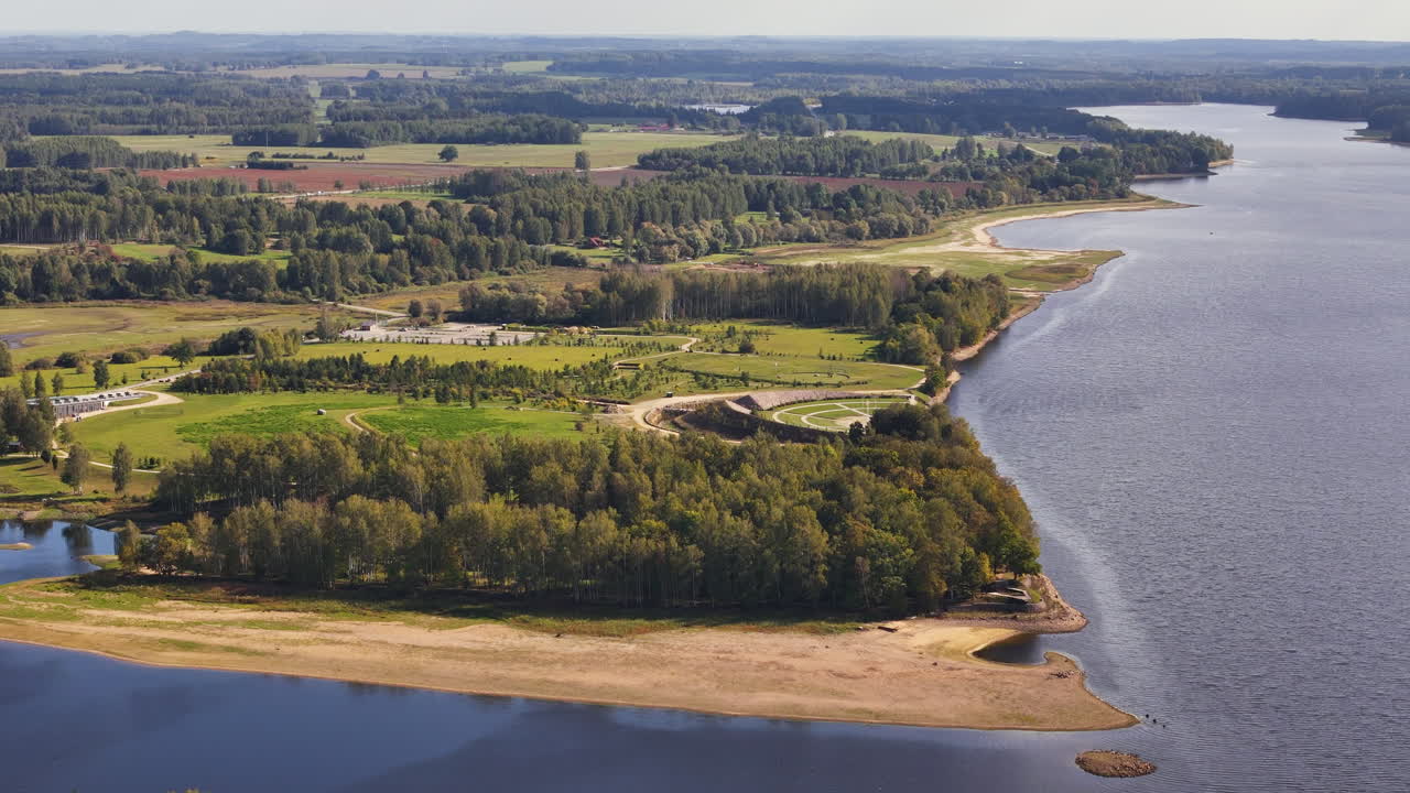 Drone footage of Koknese’s riverside ruins and sweeping countryside landscape.