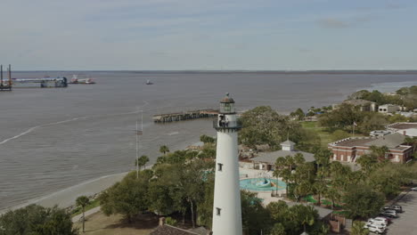 St-Simons-Georgia-Aerial-v12-pan-right-shot-of-green-space,-lighthouse-and-St-Simons-Sound---March-2020