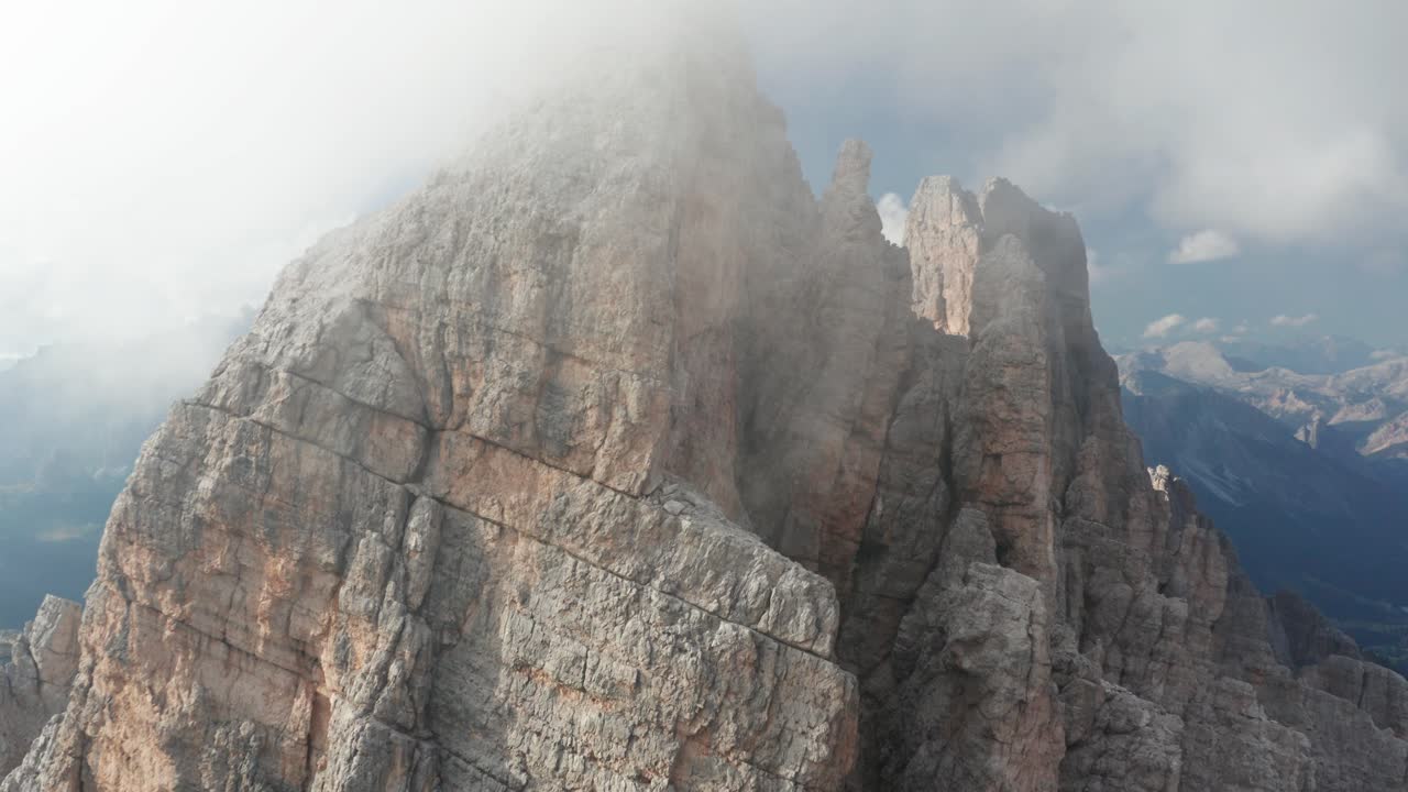 Aerial of Croda da Lago alpine mountain peaks covered in clouds