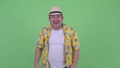 young handsome overweight asian tourist man