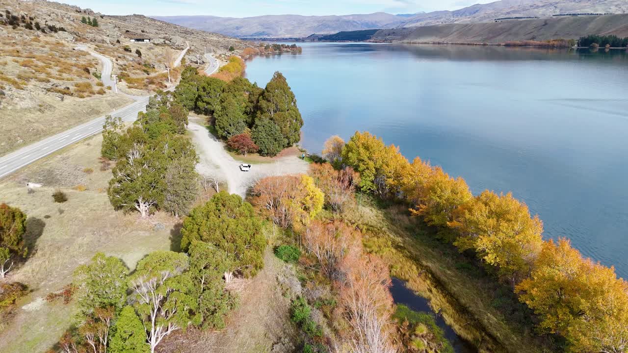 Drone flyover showcasing autumn colors and reflections