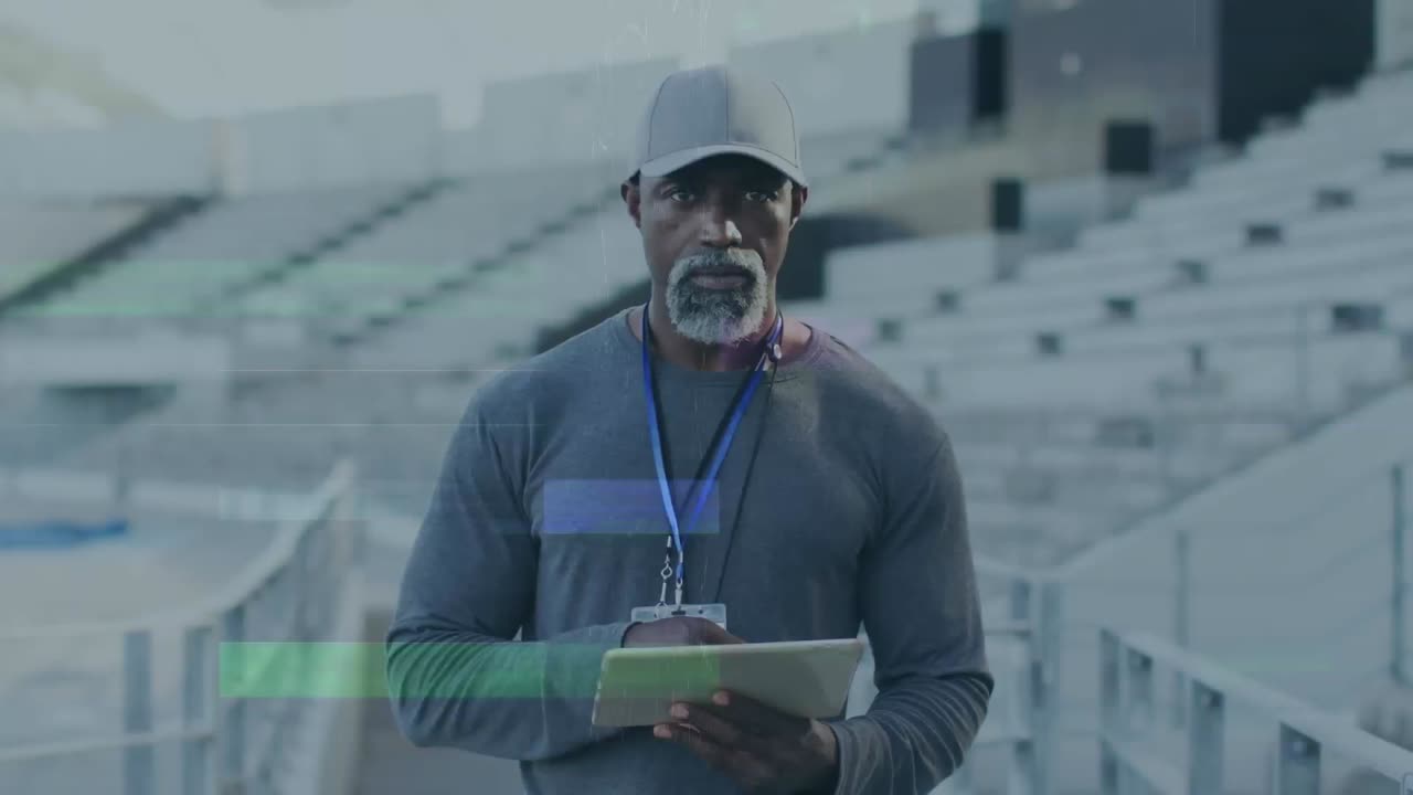 Animation of interference over african american male coach with tablet