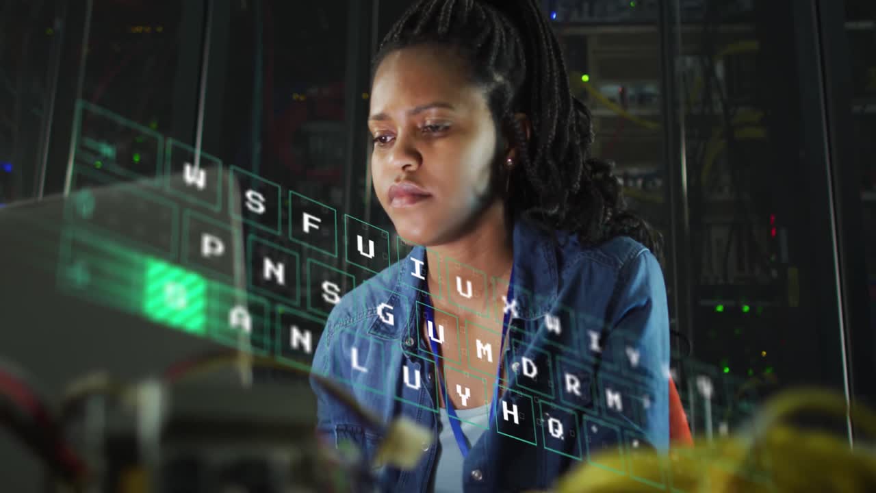 Animation of letters changing over biracial woman working on laptop in server room