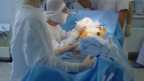 cardiosurgeon performs heart surgery with the assistance of nurse