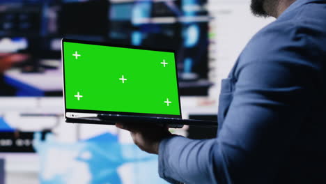 african american tech enthusiast looking at chroma key screen