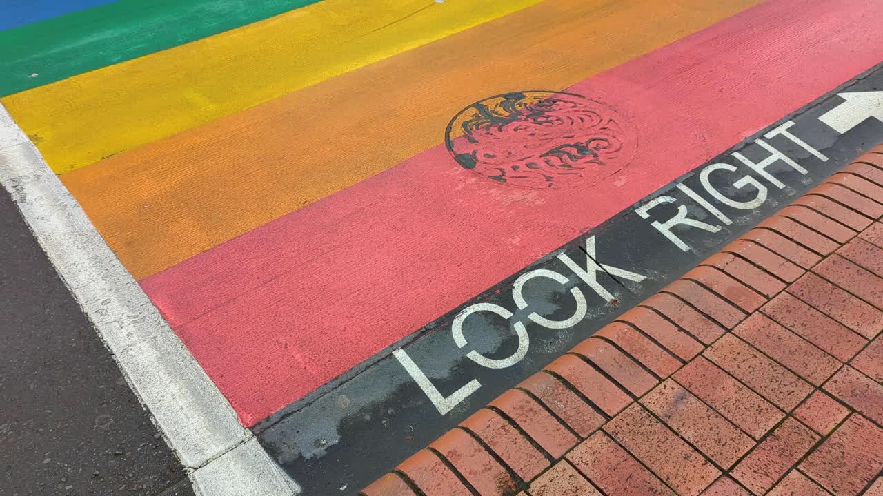 Rainbow Crosswalk and Umbrella Art in a City Pedestrian Zone