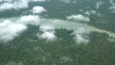 flying over river, jungle and clouds, gulf province, papua new guinea