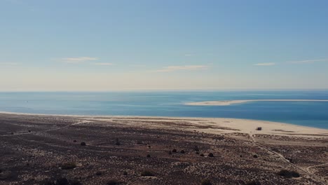 drone shot panning over the horizon. troia, portugal