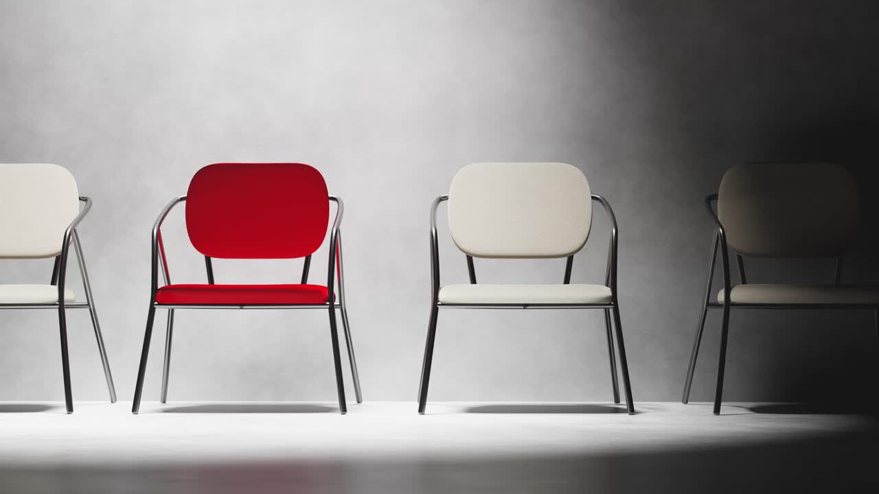 Red Chair Sliding into a Row of Empty Chairs