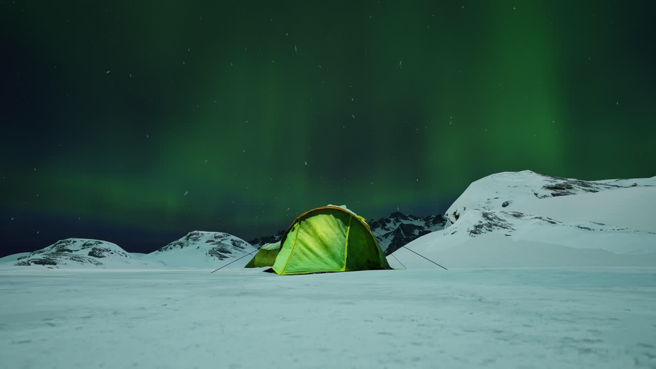 Tent Lighted From The Inside Against The Backdrop Of Incredible Sky With Northern Lights. Aurora Borealis In Winter Field