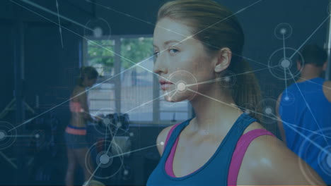 a woman in sportswear stands in a gym, surrounded by a network of digital connections