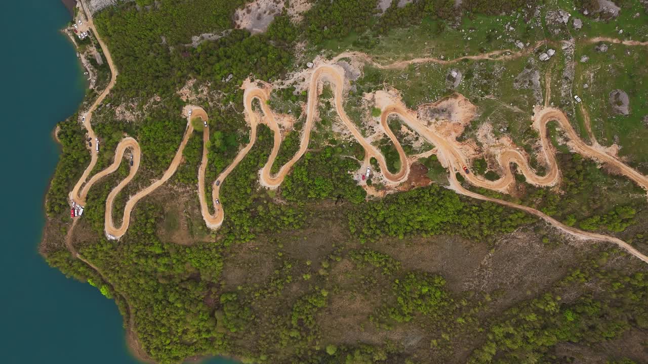 Aerial view of winding roads near Bovila Lake, Tirana, Albania, in lush nature