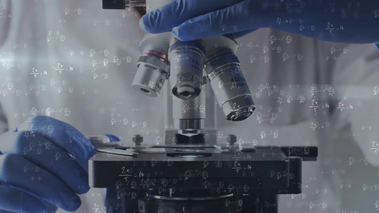 Lab tech placing slide, turning lens, focusing, showing sample for study with math overlay on hands