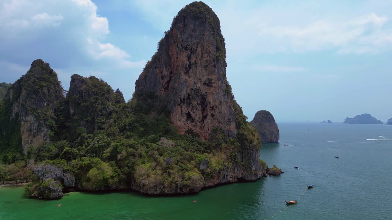 Rock climber resting during a difficult climb on Rai Leh beach cliff in Thailand. Fantastic aerial view flight speed ramp hyper motion time lapse