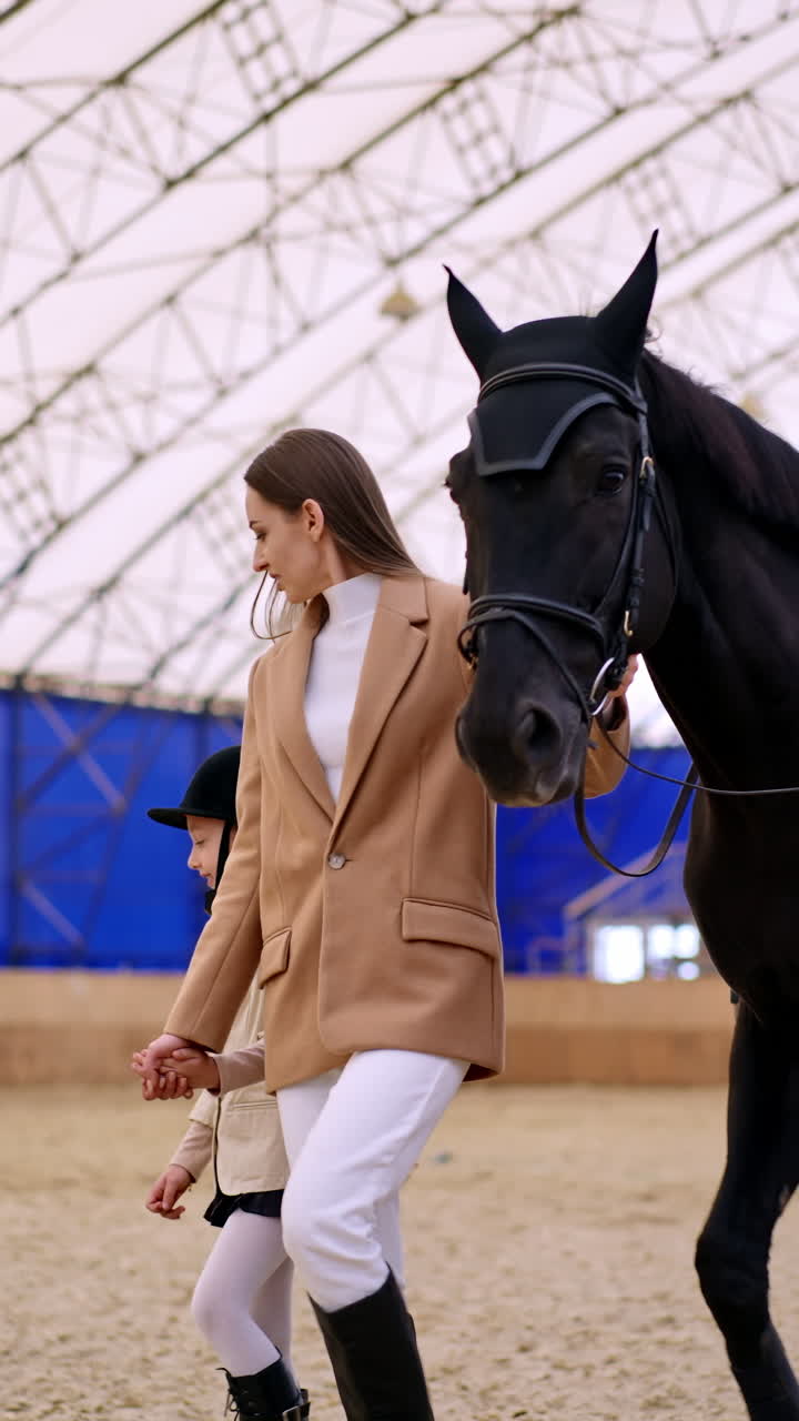 Horse riding education with instructor. Young lady with child horse ride. Vertical video
