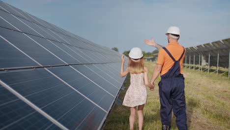 father and daughter at solar farm