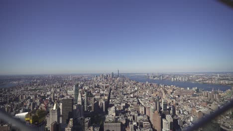 pov looking through fence empire state building nyc 4k