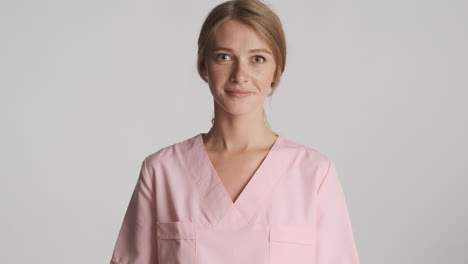 caucasian female doctor nodding on camera.