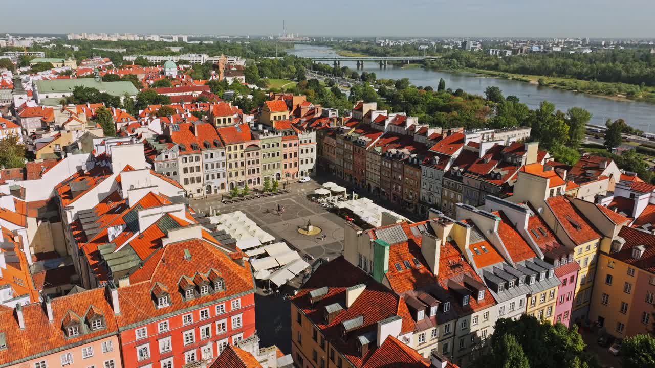 Warsaw Old Town square with historic colorful houses and iconic Mermaid Statue