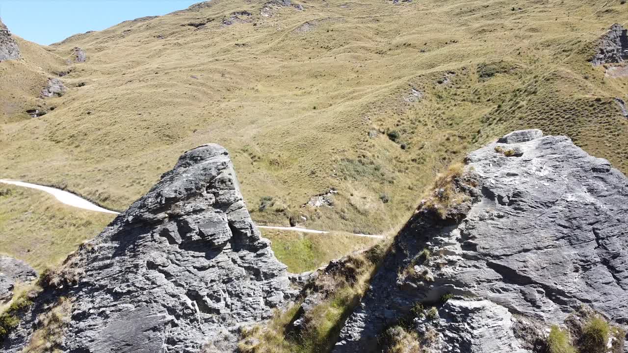 drone shot flying through two peaks and look down dangerous