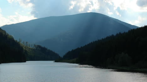 the level of the sance drinking water reservoir with a natural valley full of hills and mountains around the water level which moves in a strong wind