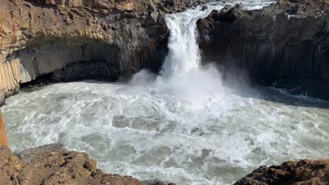 majestic waterfall aldeyjarfoss surrounded by basalt rocks in the highlands of iceland, only available to get to from an f-road