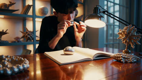person reading a book at a study desk