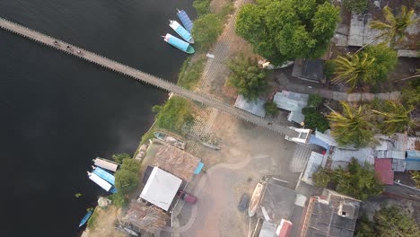 Aerial-view-of-a-fishing-village-over-a-river-and-some-clouds-in-La-Antigua,-Veracruz,-Mexico