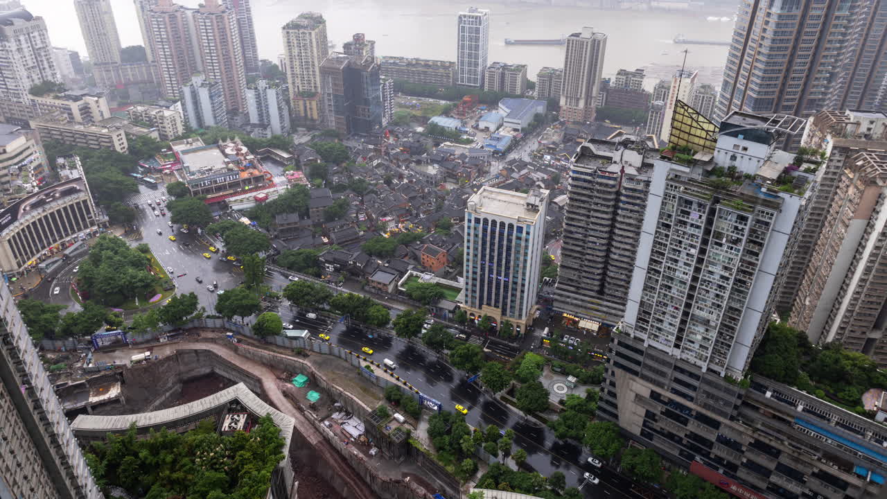 Timelapse of the amazing Chongqing cyberpunk city skyline from a high vantage point wirh the yangtze river