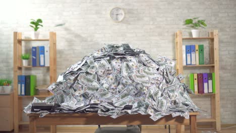 big pile of bills banknotes on the office desk, no body