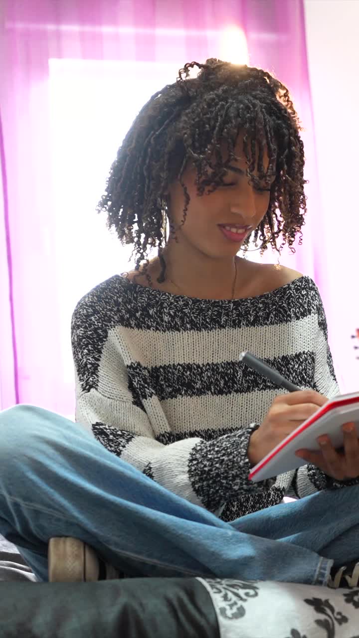 Two people studying together with notebooks