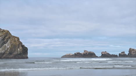 cat and kittens rock formations off bandon beach face rock state park southern oregon, usa - aerial sideways